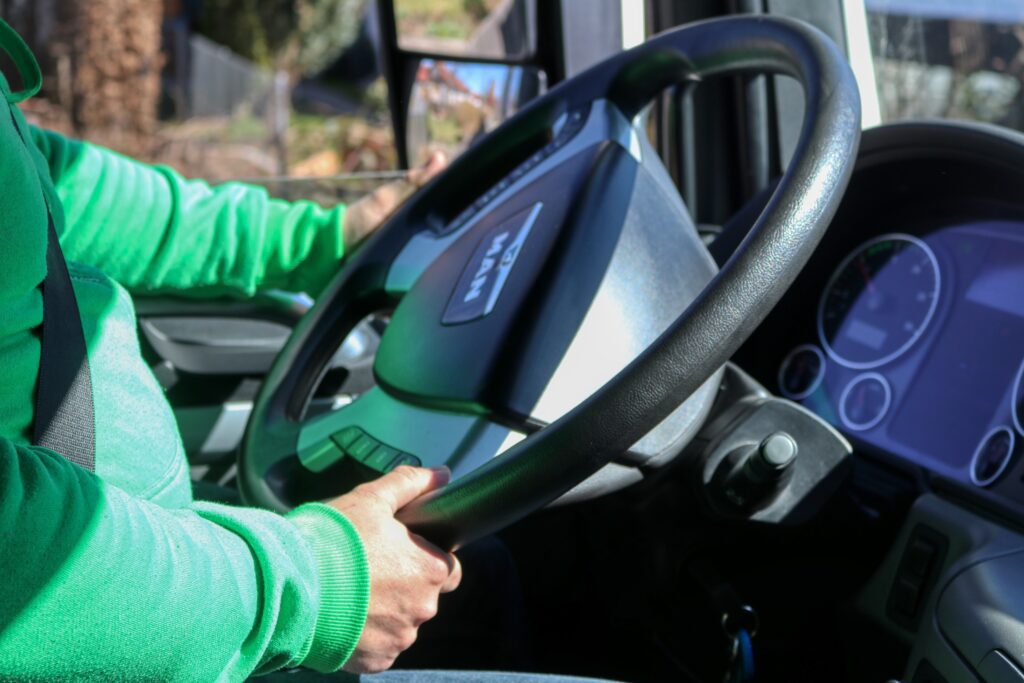 Man sitting behind the steering wheel of a van