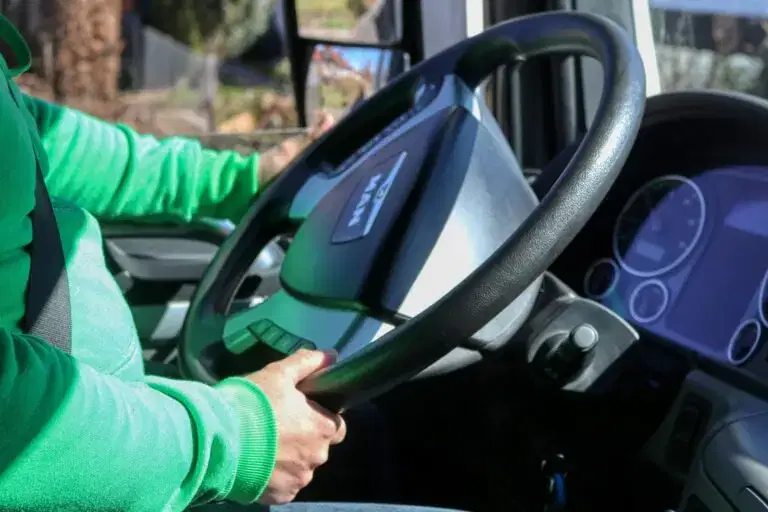 Man sitting behind the steering wheel of a van