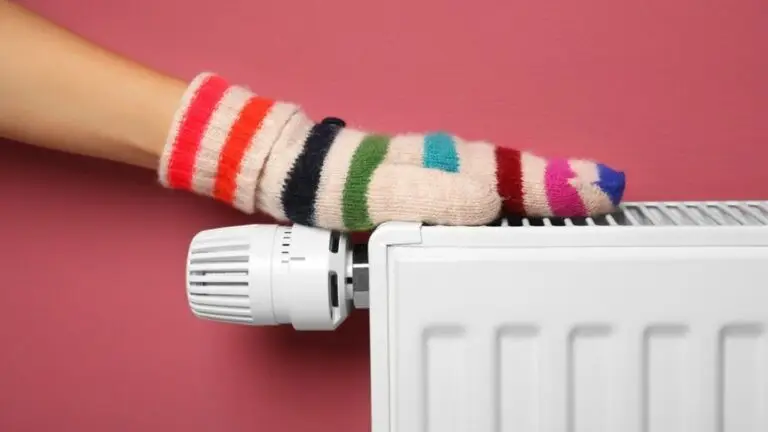 Gloved hand placed on top of a radiator